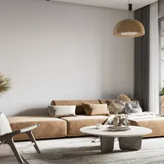 Salon w stylu wabi sabi z beżową kanapą, plecionym fotelem i suszonymi trawami. Naturalne materiały i stonowana paleta barw tworzą spokojną atmosferę.