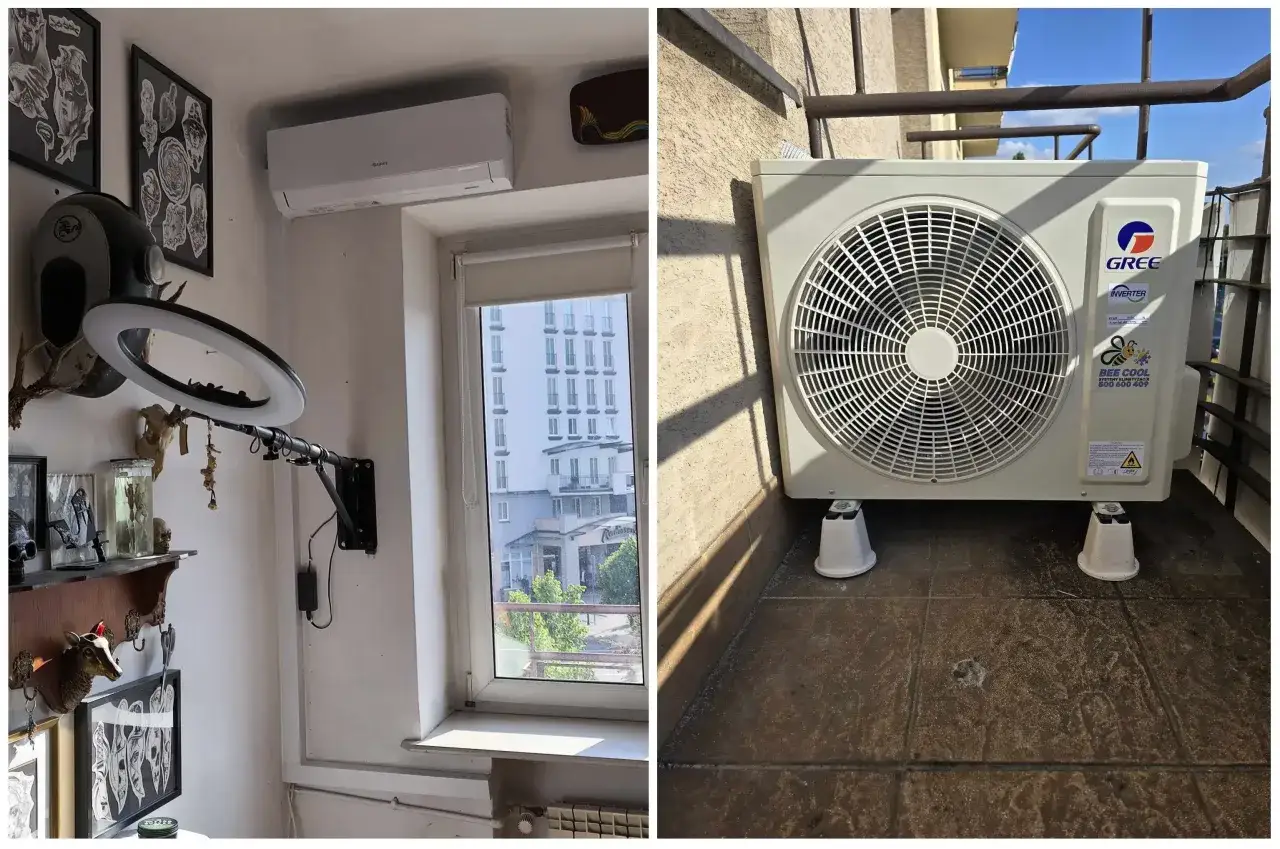 Klimatyzator w salonie, zamontowany nad oknem, zapewnia chłód. Jednostka zewnętrzna stoi na balkonie.